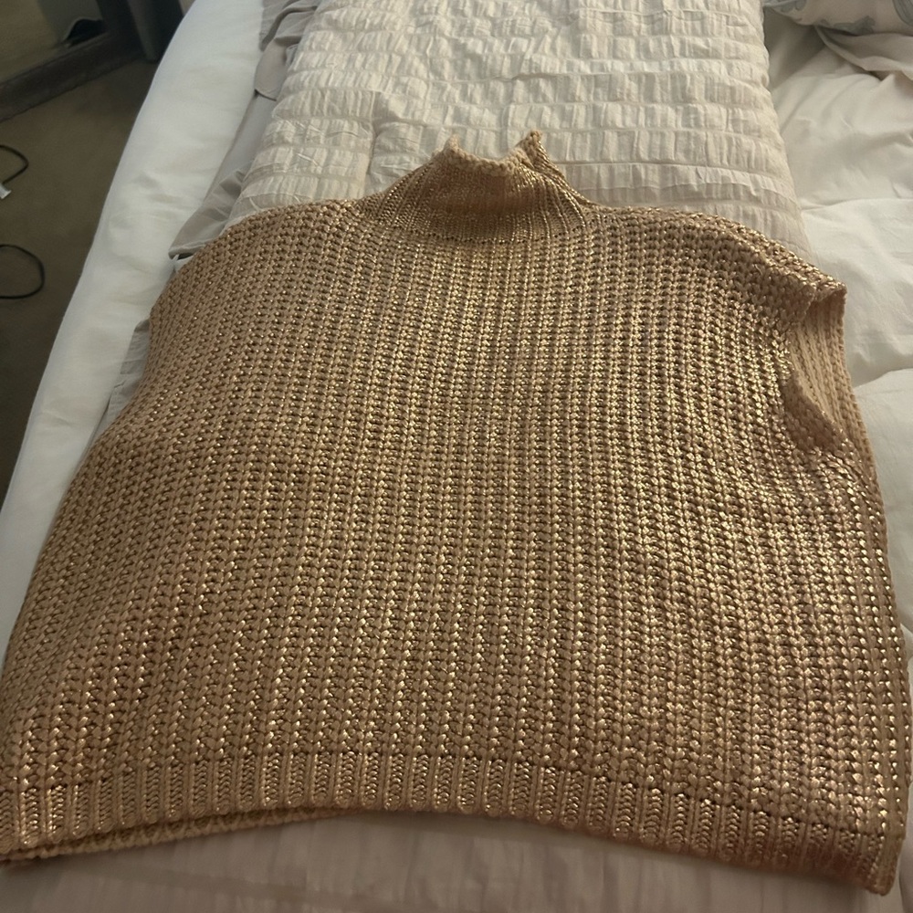 Women’s gold sweater